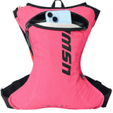 USWE lightweight race hydration pack in pink with black shoulder straps and zippered front pocket holding smartphone, showing minimalist design and ergonomic fit system for mountain biking and gravel racing.